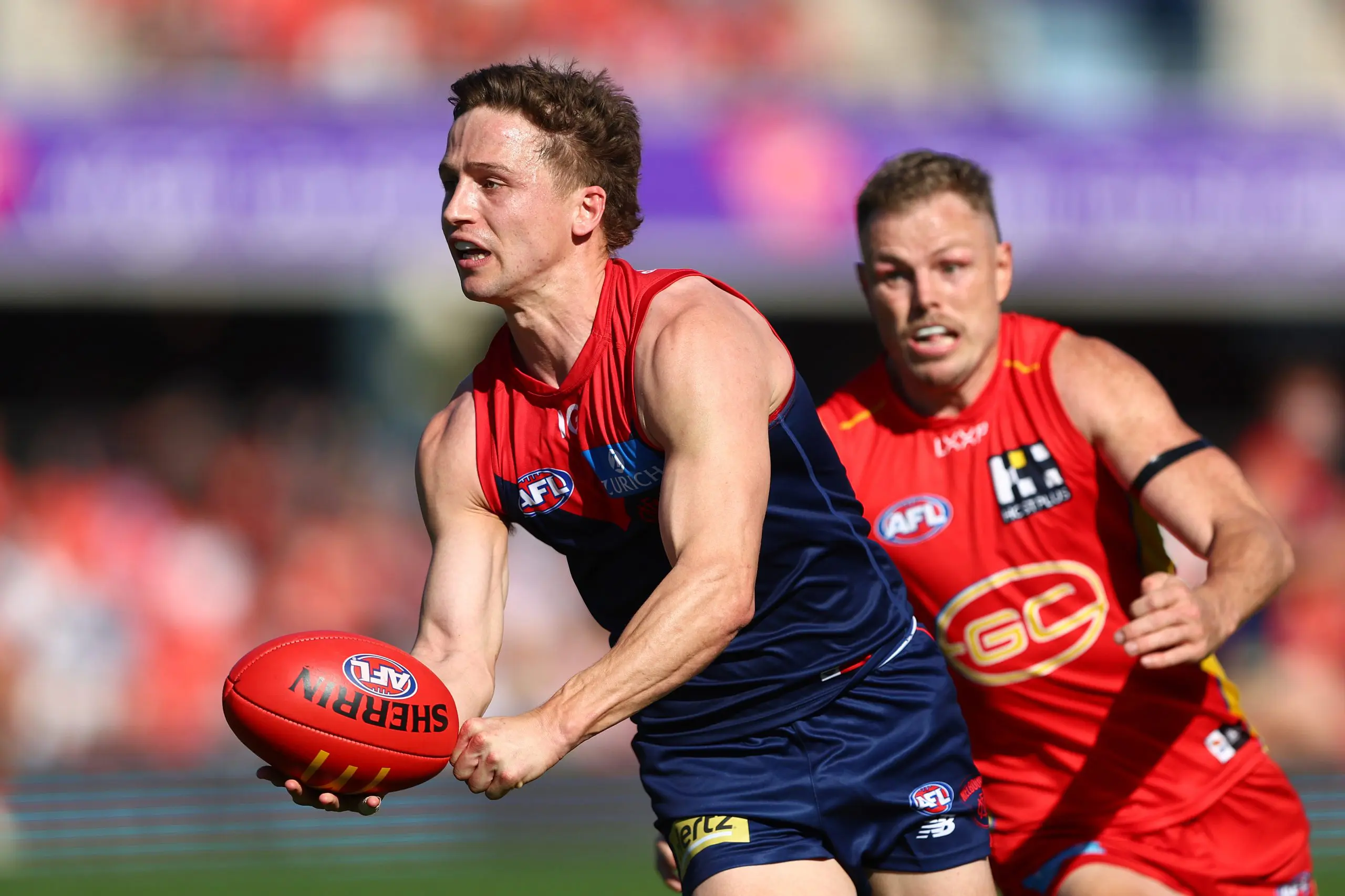 GOLD COAST, AUSTRALIA - AUGUST 17: Jack Billings of the Demons in action during the round 23 AFL match between Gold Coast Suns and Melbourne Demons at People First Stadium, on August 17, 2024, in Gold Coast, Australia. (Photo by Chris Hyde/Getty Images)