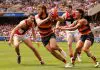 ADELAIDE, AUSTRALIA - MARCH 16: Zaine Cordy of the Saints tackles Riley Thilthorpe of the Crows during the 2025 AFL Round 01 match between the Adelaide Crows and the St Kilda Saints at Adelaide Oval on March 16, 2025 in Adelaide, Australia. (Photo by James Elsby/AFL Photos via Getty Images)