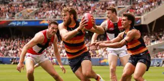 ADELAIDE, AUSTRALIA - MARCH 16: Zaine Cordy of the Saints tackles Riley Thilthorpe of the Crows during the 2025 AFL Round 01 match between the Adelaide Crows and the St Kilda Saints at Adelaide Oval on March 16, 2025 in Adelaide, Australia. (Photo by James Elsby/AFL Photos via Getty Images)