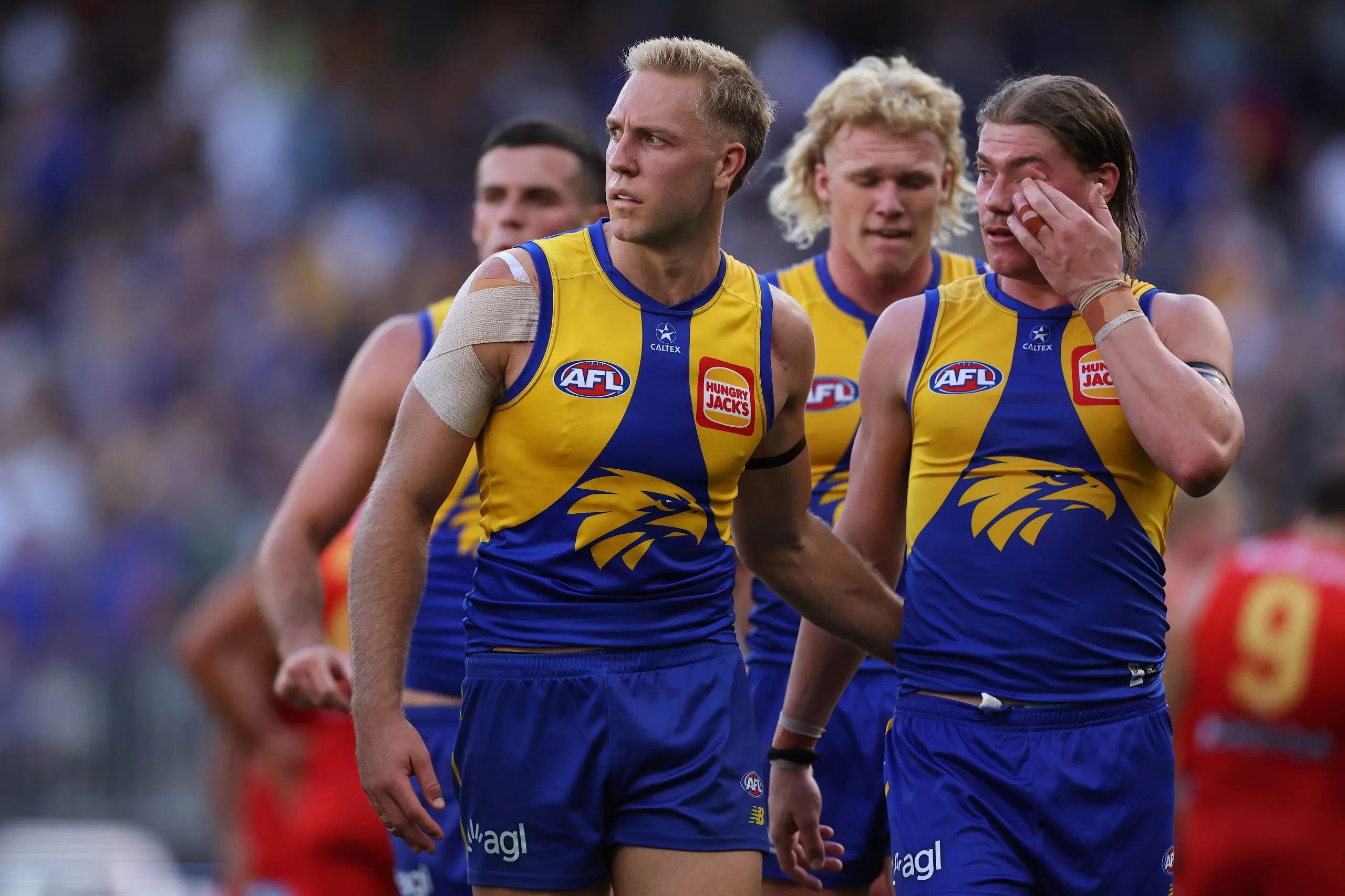 PERTH, AUSTRALIA - MARCH 16: Oscar Allen and Harley Reid of the Eagles walk from the field at the half time break during the round one AFL match between West Coast Eagles and Gold Coast Suns at Perth Stadium, on March 16, 2025, in Perth, Australia. (Photo by Paul Kane/Getty Images)