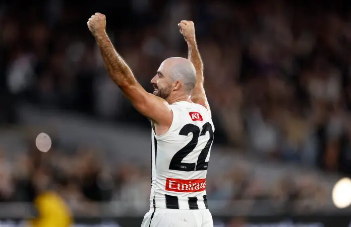 MELBOURNE, AUSTRALIA - MARCH 21: Steele Sidebottom of the Magpies celebrates as the final siren sounds during the 2025 AFL Round 02 match between the Footscray Bulldogs and the Collingwood Magpies at the Melbourne Cricket Ground on March 21, 2025 in Melbourne, Australia. (Photo by Michael Willson/AFL Photos via Getty Images)
