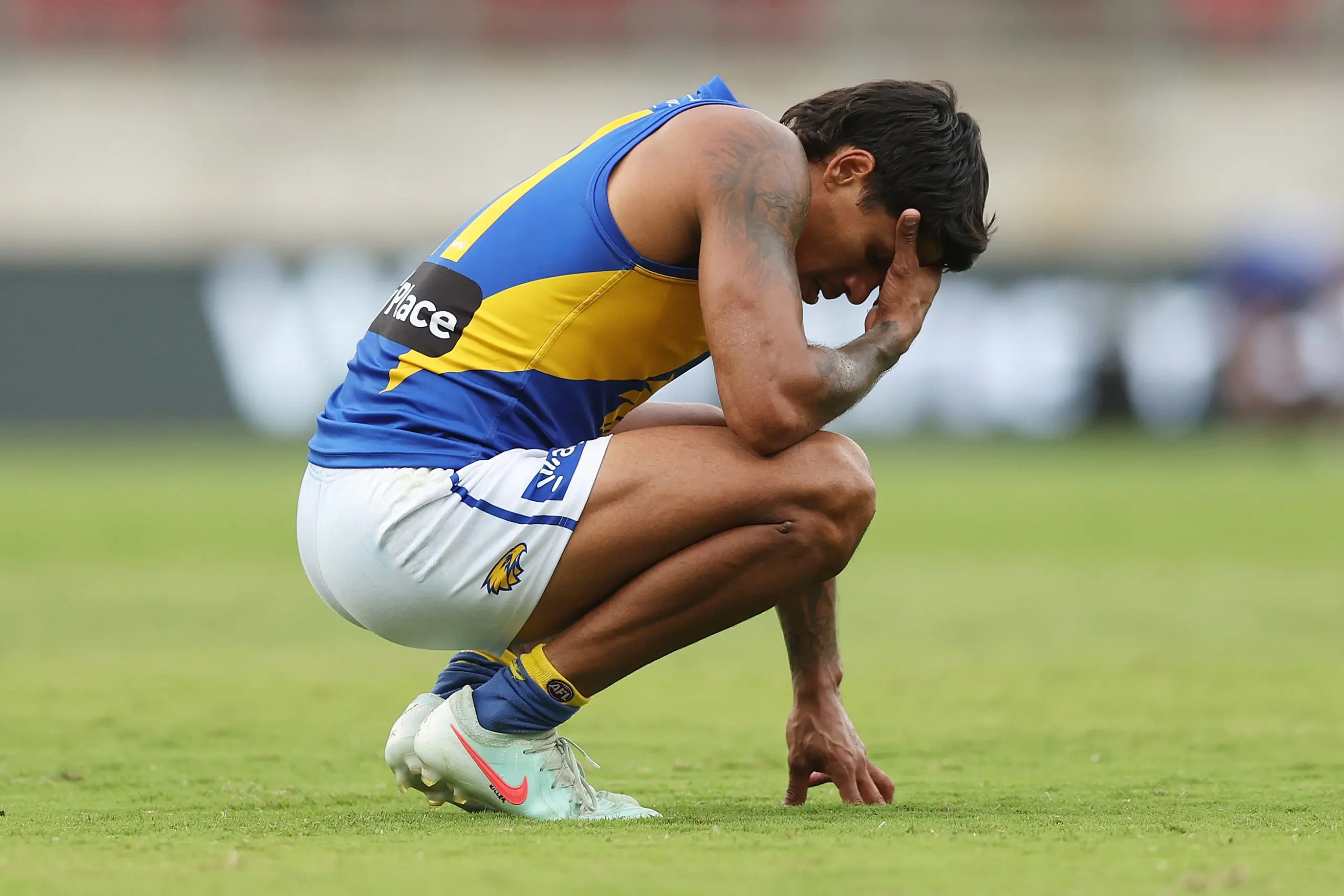SYDNEY, AUSTRALIA - APRIL 06: Tim Kelly of the Eagles reacts after defeat during the round four AFL match between GWS Giants and West Coast Eagles at ENGIE Stadium, on April 06, 2025, in Sydney, Australia. (Photo by Mark Metcalfe/AFL Photos/via Getty Images)