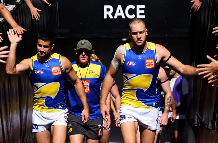 ADELAIDE, AUSTRALIA - APRIL 12: Oscar Allen of the Eagles leads his team out onto the field  during the round five AFL match between Carlton Blues and West Coast Eagles at Adelaide Oval, on April 12, 2025, in Adelaide, Australia. (Photo by Quinn Rooney/Getty Images)