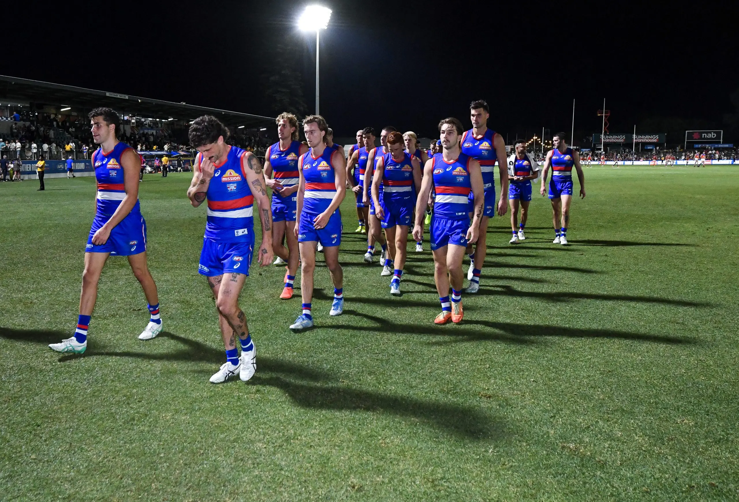 ADELAIDE, AUSTRALIA - APRIL 12: Western Bulldogs leave the ground after losing the round five AFL match between Western Bulldogs and Brisbane Lions at Norwood Oval, on April 12, 2025, in Adelaide, Australia. (Photo by Mark Brake/Getty Images)