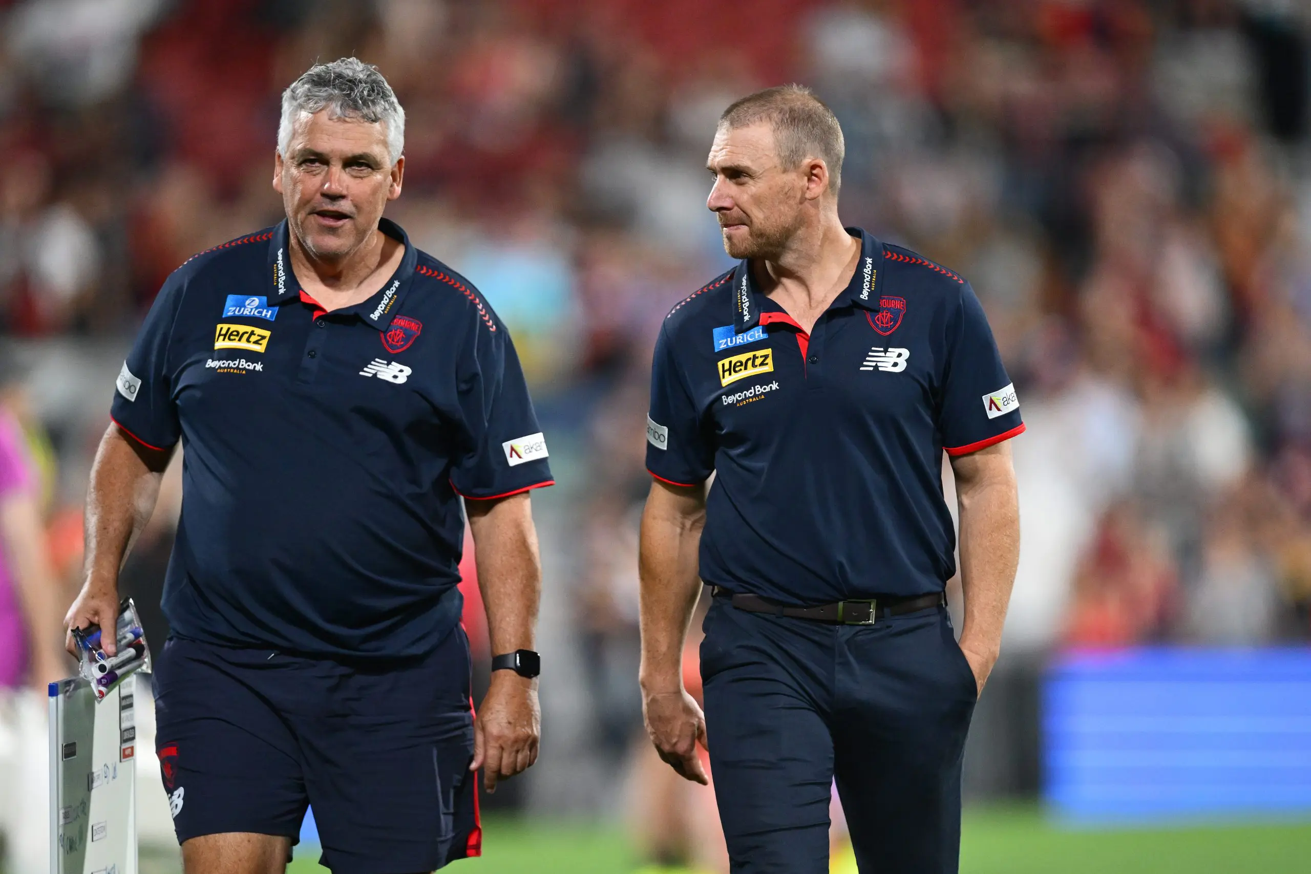 ADELAIDE, AUSTRALIA - APRIL 12: Simon Goodwin, Coach of the Demons looks on after the loss during the round five AFL match between Melbourne Demons and Essendon Bombers at Adelaide Oval, on April 12, 2025, in Adelaide, Australia. (Photo by Quinn Rooney/Getty Images)