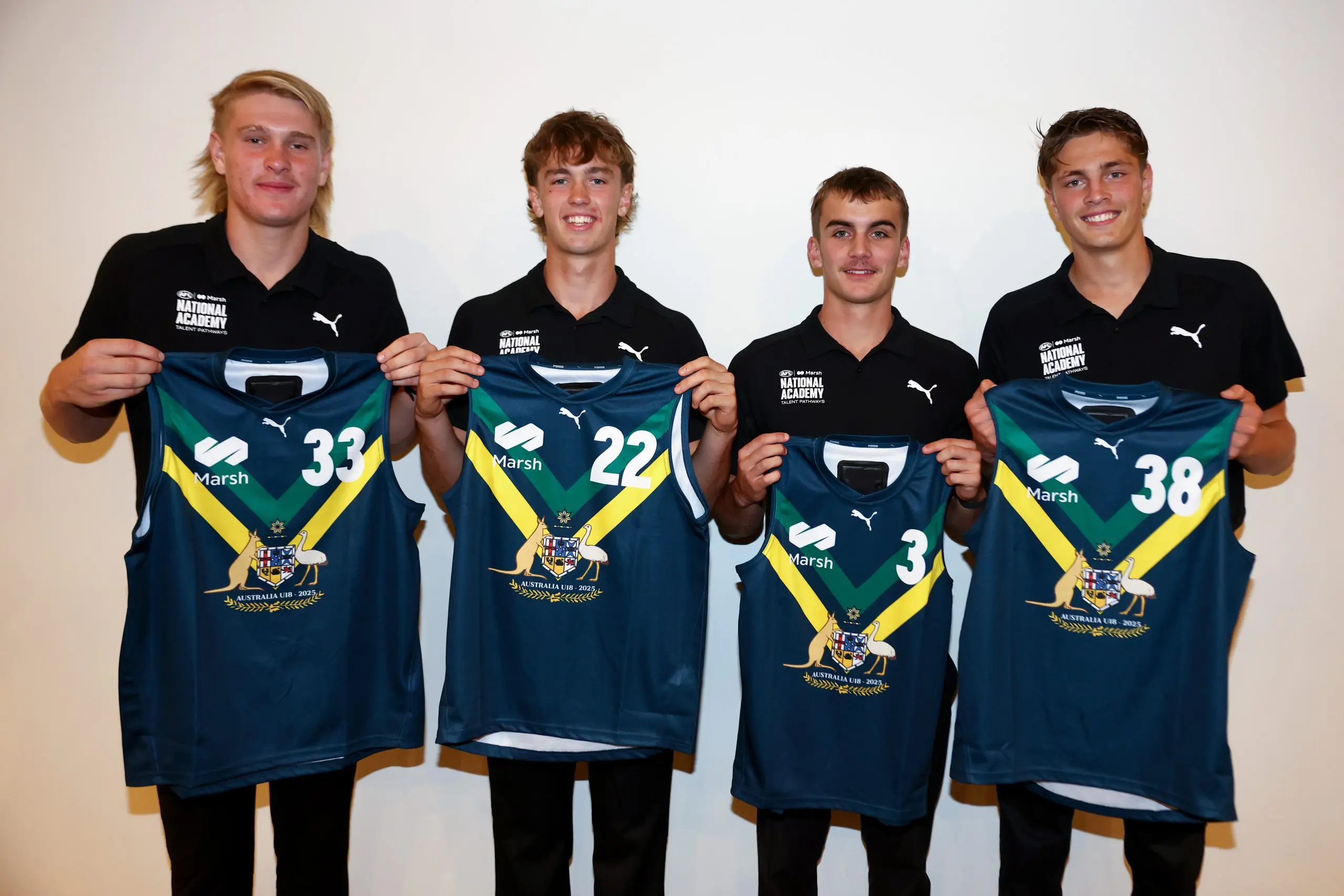 MELBOURNE, AUSTRALIA - APRIL 12: Cody Curtin, Noah Chamberlain, Lachlan Carmichael and Archie Ludowyke of the AFL National Academy pose after being presented with their jumpers during the Marsh AFL National Academy Boys Jumper Presentation at Mercure Albert Park on April 12, 2025 in Melbourne, Australia. (Photo by Josh Chadwick/AFL Photos/via Getty Images)