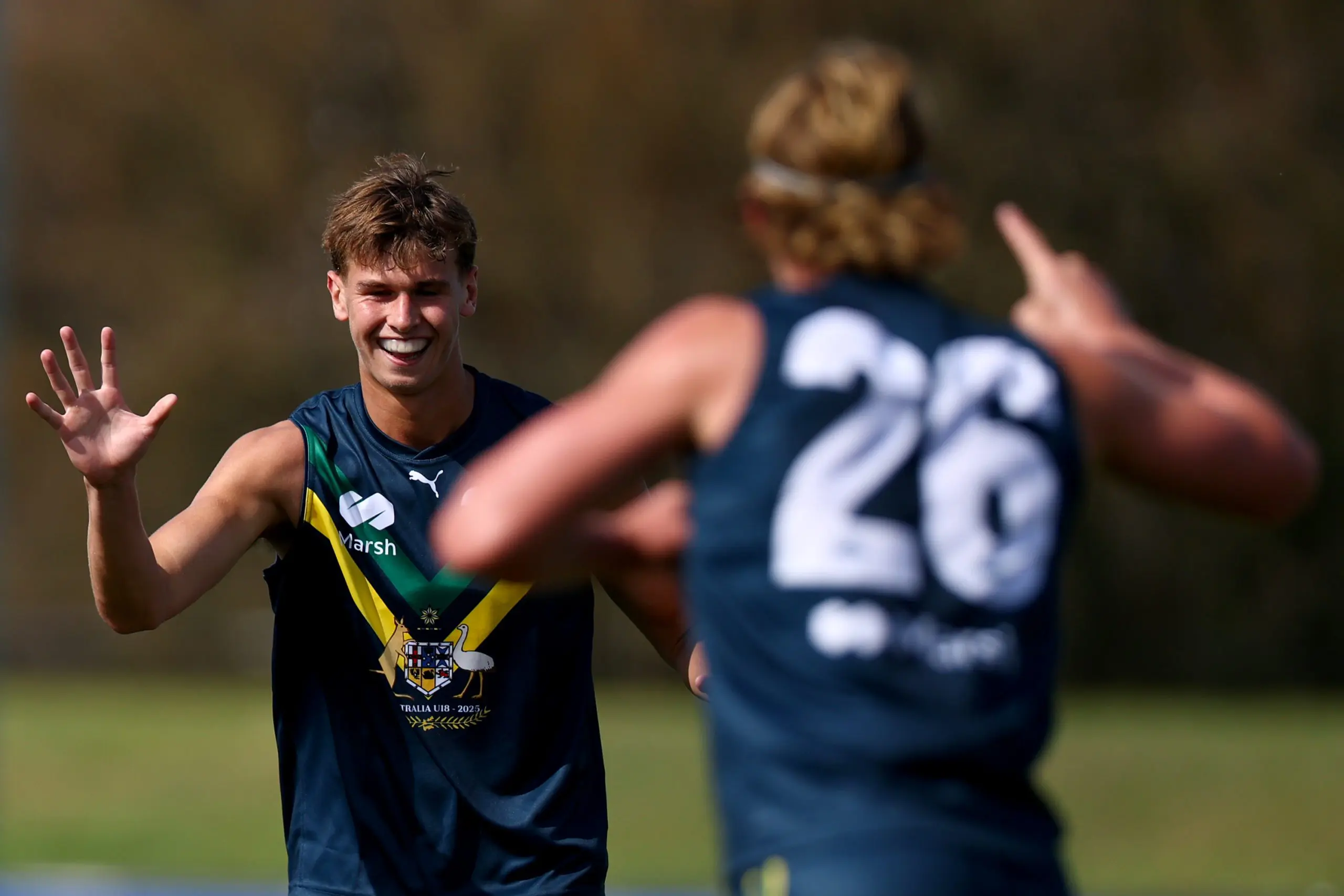 MELBOURNE, AUSTRALIA - APRIL 13: Cooper Duff-Tytler of the AFL National Academy is congratulated by team mates after kicking a goal during the Marsh AFL National Academy Boys match between Australia U18 and Richmond VFL at RSEA Park on April 13, 2025 in Melbourne, Australia. (Photo by Josh Chadwick/AFL Photos/via Getty Images)