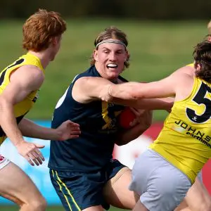 MELBOURNE, AUSTRALIA - APRIL 13: Oliver Greeves of the AFL National Academy is tackled by Lachlan Wilson of the Tigers during the Marsh AFL National Academy Boys match between Australia U18 and Richmond VFL at RSEA Park on April 13, 2025 in Melbourne, Australia. (Photo by Josh Chadwick/AFL Photos/via Getty Images)