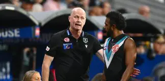 ADELAIDE, AUSTRALIA - APRIL 13: Ken Hinkley, Senior Coach of the Power speaks to Willie Rioli of the Power during the round five AFL match between Port Adelaide Power and Hawthorn Hawks at Adelaide Oval, on April 13, 2025, in Adelaide, Australia. (Photo by Quinn Rooney/Getty Images)