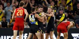 MELBOURNE, AUSTRALIA - APRIL 19: (L-R) Seth Campbell, Tim Taranto and Hugo Ralphsmith of the Tigers celebrate during the 2025 AFL Round 06 match between the Richmond Tigers and the Gold Coast Suns at Marvel Stadium on April 19, 2025 in Melbourne, Australia. (Photo by Michael Willson/AFL Photos via Getty Images)