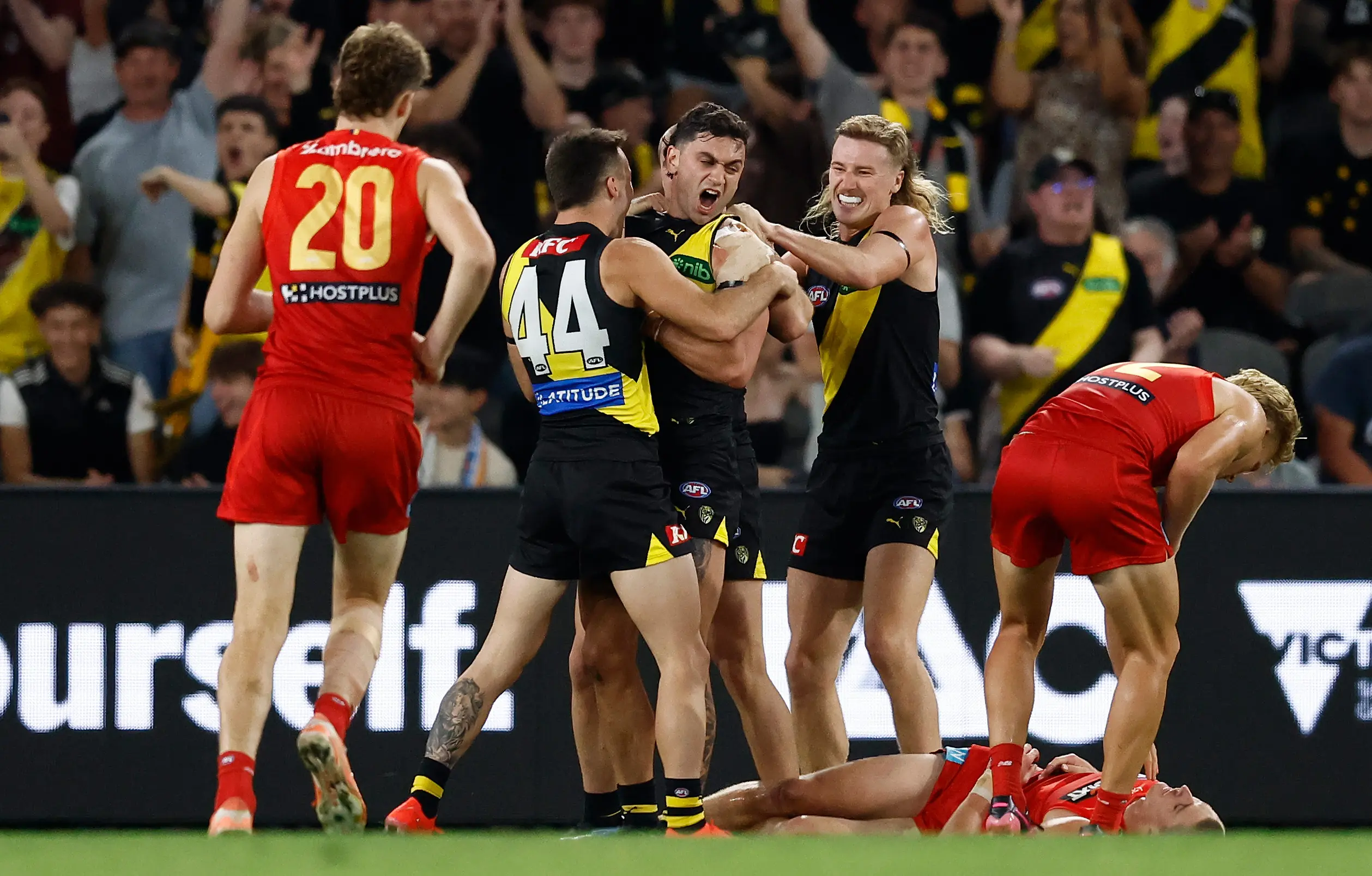 MELBOURNE, AUSTRALIA - APRIL 19: (L-R) Seth Campbell, Tim Taranto and Hugo Ralphsmith of the Tigers celebrate during the 2025 AFL Round 06 match between the Richmond Tigers and the Gold Coast Suns at Marvel Stadium on April 19, 2025 in Melbourne, Australia. (Photo by Michael Willson/AFL Photos via Getty Images)