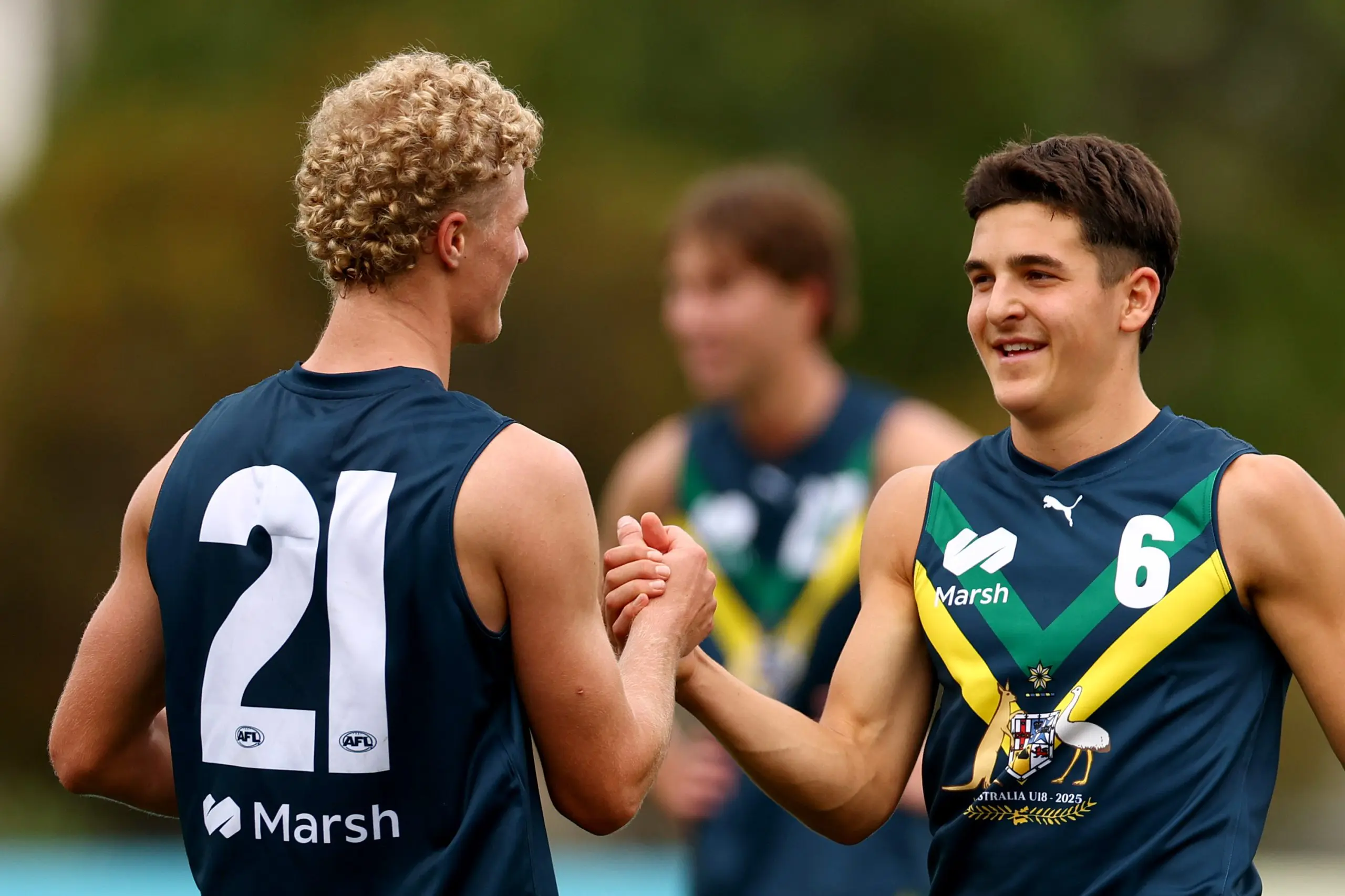 MELBOURNE, AUSTRALIA - APRIL 27: Josh Lindsay and Harley Barker of the AFL National Academy embrace after winning the Marsh AFL National Academy Boys match between Australia U18 and Coburg VFL at Whitten Oval on April 27, 2025 in Melbourne, Australia. (Photo by Josh Chadwick/AFL Photos/via Getty Images)