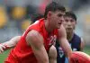 MELBOURNE, AUSTRALIA - APRIL 26: Zac Harding of the Young Guns handpasses the ball during the Young Guns 2025 series match between the Young Guns and the Victoria Metro U18 Boys at Melbourne Avalon Airport Oval on April 26, 2025 in Melbourne, Australia. (Photo by Rob Lawson/AFL Photos)