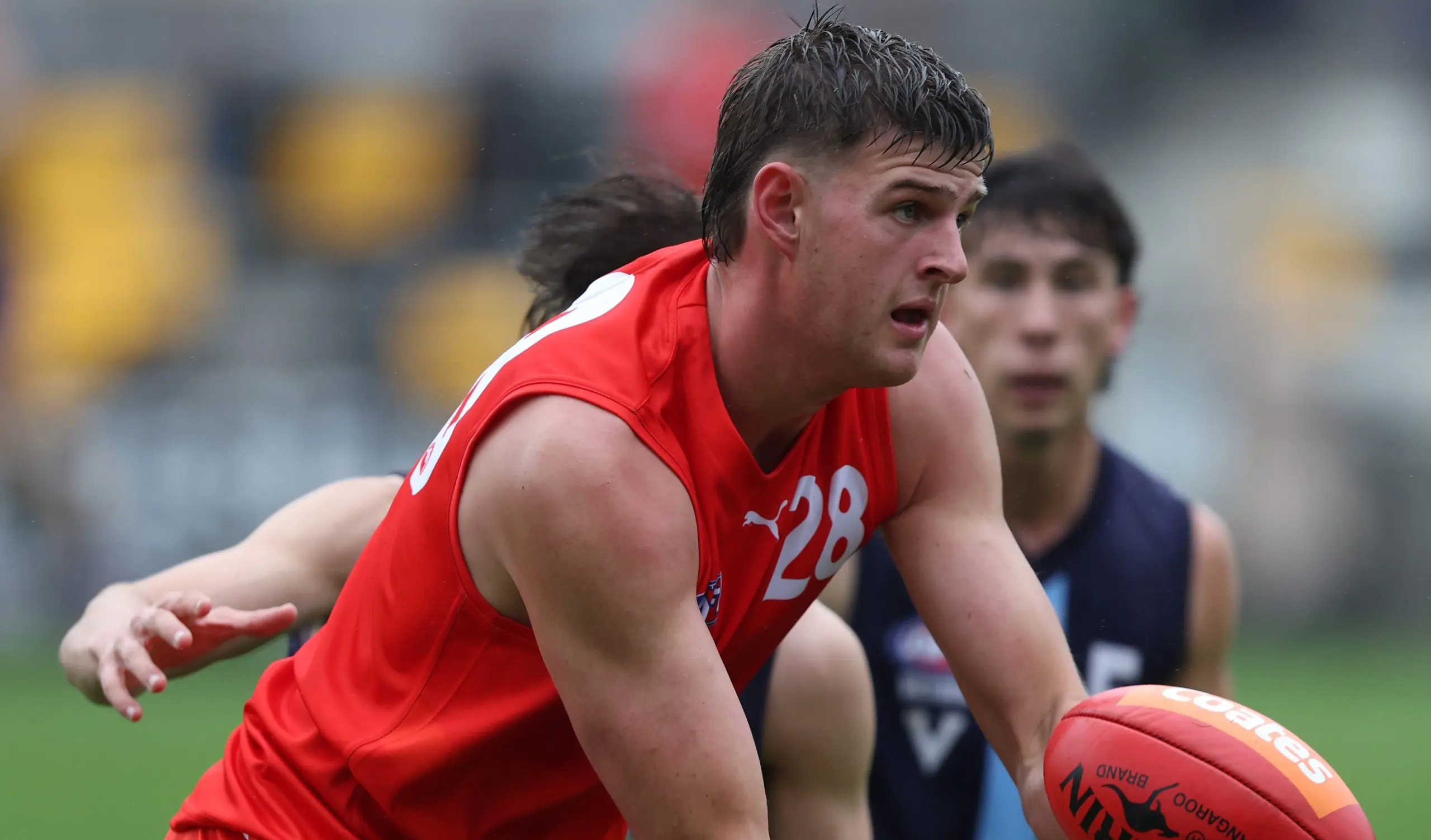 MELBOURNE, AUSTRALIA - APRIL 26: Zac Harding of the Young Guns handpasses the ball during the Young Guns 2025 series match between the Young Guns and the Victoria Metro U18 Boys at Melbourne Avalon Airport Oval on April 26, 2025 in Melbourne, Australia. (Photo by Rob Lawson/AFL Photos)