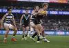 GEELONG, AUSTRALIA - MAY 10: Tom Atkins of the Cats tackles Jason Horne-Francis of the Power during the round nine AFL match between Geelong Cats and Port Adelaide Power at GMHBA Stadium, on May 10, 2024, in Geelong, Australia. (Photo by Darrian Traynor/Getty Images)