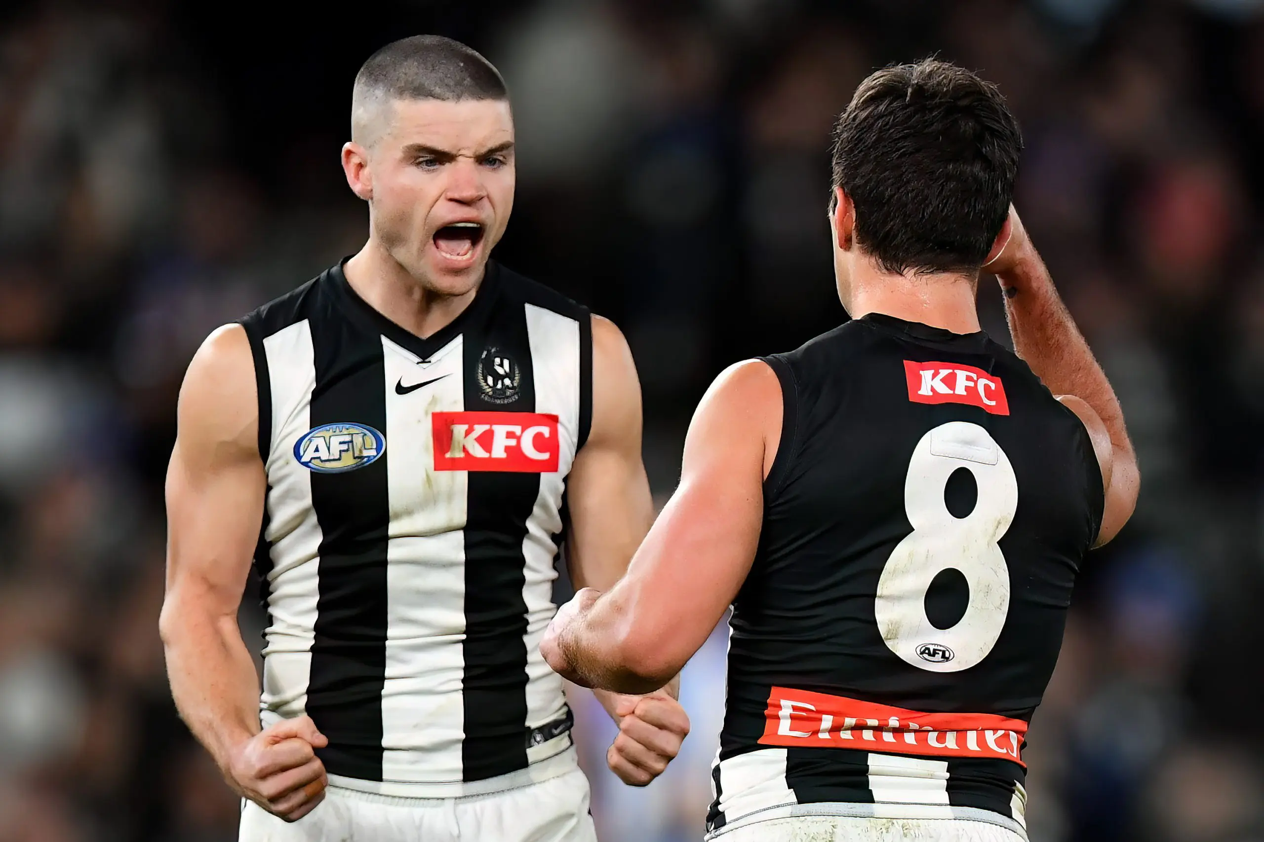 MELBOURNE, AUSTRALIA - JUNE 16: Lachie Schultz of the Magpies is congratulated by Lachlan Sullivan after kicking a goal during the round 14 AFL match between North Melbourne Kangaroos and Collingwood Magpies at Marvel Stadium, on June 16, 2024, in Melbourne, Australia. (Photo by Josh Chadwick/AFL Photos/Getty Images)