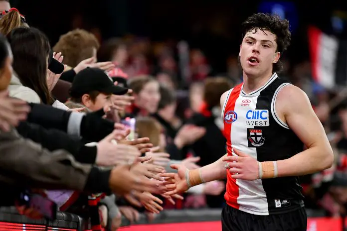 MELBOURNE, AUSTRALIA - JULY 20: Darcy Wilson of the Saints high fives fans after winning the round 19 AFL match between St Kilda Saints and West Coast Eagles at Marvel Stadium, on July 20, 2024, in Melbourne, Australia. (Photo by Josh Chadwick/AFL Photos/via Getty Images)