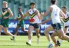 MELBOURNE, AUSTRALIA - SEPTEMBER 28: Tairon Ah-Mu of Team Sloane kicks the ball during the Marsh AFL National Futures Boys match between Team Heppell and Team Sloane at Melbourne Cricket Ground, on September 28, 2024, in Melbourne, Australia. (Photo by Daniel Pockett/AFL Photos/via Getty Images)