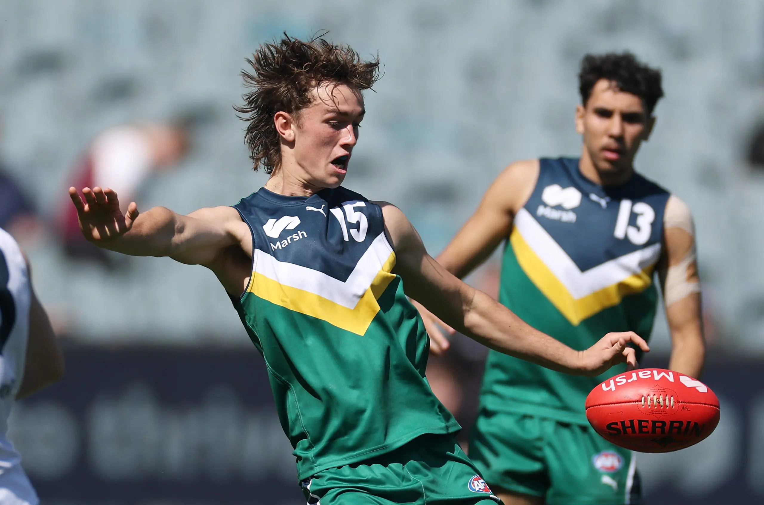 MELBOURNE, AUSTRALIA - SEPTEMBER 28: Noah Chamberlain of Team Heppell kicks for goal during the Marsh AFL National Futures Boys match between Team Heppell and Team Sloane at Melbourne Cricket Ground, on September 28, 2024, in Melbourne, Australia. (Photo by Daniel Pockett/AFL Photos/via Getty Images)