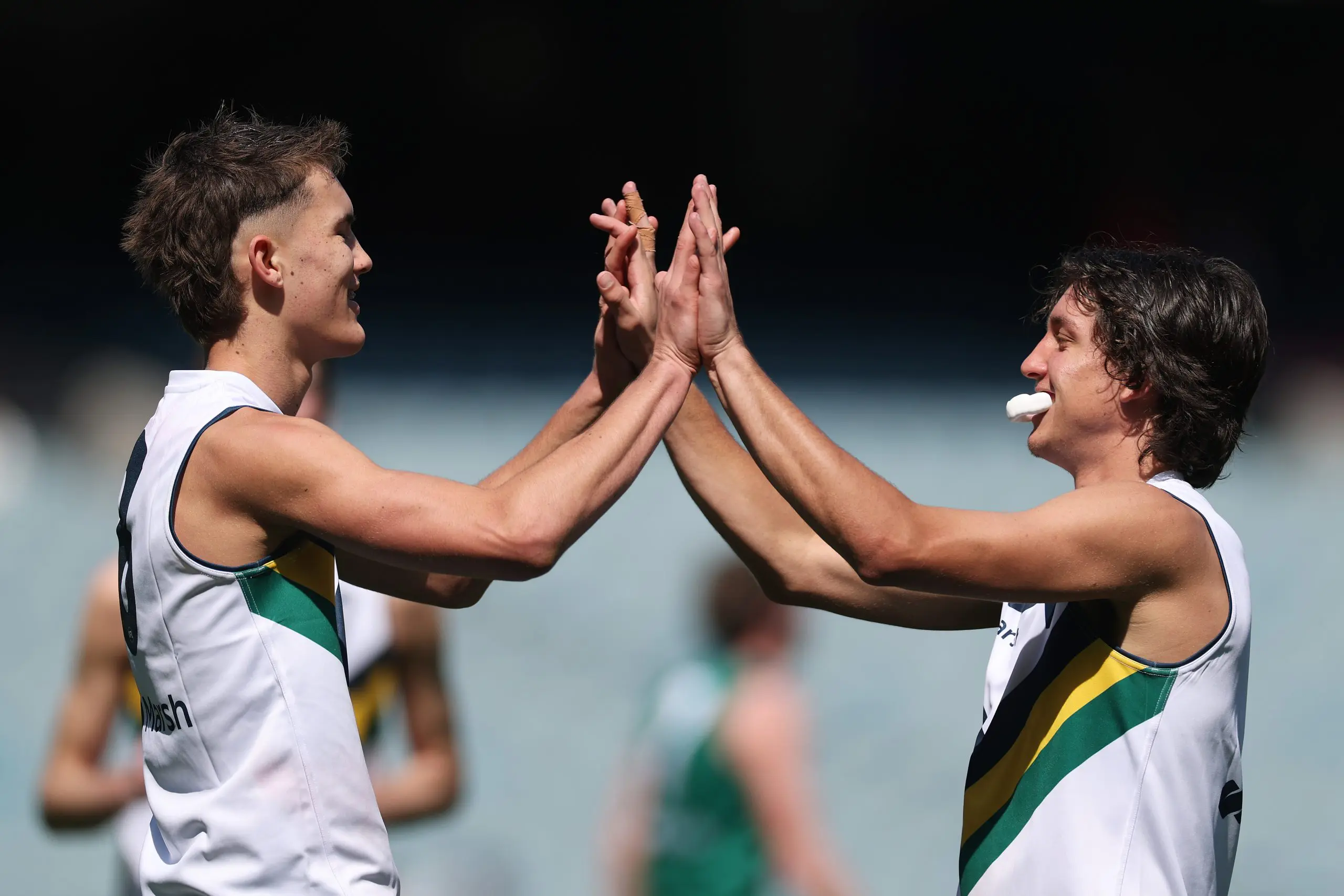 MELBOURNE, AUSTRALIA - SEPTEMBER 28: Jack Ison of Team Sloane celebrates kicking a goal with Toby Whan during the Marsh AFL National Futures Boys match between Team Heppell and Team Sloane at Melbourne Cricket Ground, on September 28, 2024, in Melbourne, Australia. (Photo by Daniel Pockett/AFL Photos/via Getty Images)