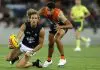 CANBERRA, AUSTRALIA - FEBRUARY 28: Nick Haynes of the Blues handballs during the 2025 AAMI AFL Community Series match between Greater Western Sydney Giants and Carlton Blues at Manuka Oval on February 28, 2025 in Canberra, Australia. (Photo by Darrian Traynor/Getty Images)