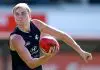 MELBOURNE, AUSTRALIA - MARCH 09: Harry Lemmey of the Blues handballs during a Carlton Blues AFL training session at Ikon Park on March 09, 2025 in Melbourne, Australia. (Photo by Josh Chadwick/Getty Images)