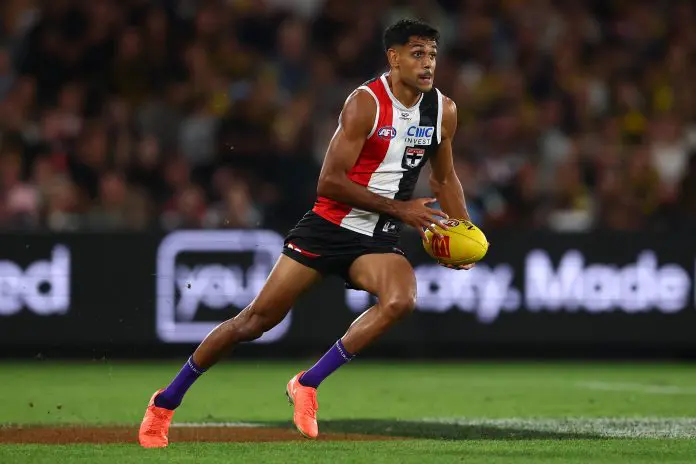 MELBOURNE, AUSTRALIA - MARCH 29: Nasiah Wanganeen-Milera of the Saints runs with the ball during the round three AFL match between St Kilda Saints and Richmond Tigers at Marvel Stadium, on March 29, 2025, in Melbourne, Australia. (Photo by Morgan Hancock/AFL Photos/via Getty Images)