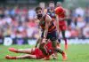 GOLD COAST, AUSTRALIA - APRIL 05: Wayne Milera of the Crows handballs under pressure during the round four AFL match between Gold Coast Suns and Adelaide Crows at People First Stadium, on April 05, 2025, in Gold Coast, Australia. (Photo by Matt Roberts/AFL Photos/via Getty Images)