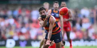 GOLD COAST, AUSTRALIA - APRIL 05: Wayne Milera of the Crows handballs under pressure during the round four AFL match between Gold Coast Suns and Adelaide Crows at People First Stadium, on April 05, 2025, in Gold Coast, Australia. (Photo by Matt Roberts/AFL Photos/via Getty Images)