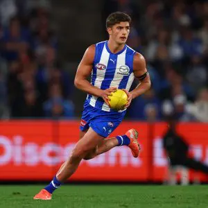 MELBOURNE, AUSTRALIA - APRIL 05: Harry Sheezel of the Kangaroos takes possession of the ball during the round four AFL match between North Melbourne Kangaroos and Sydney Swans at Marvel Stadium, on April 05, 2025, in Melbourne, Australia. (Photo by Morgan Hancock/Getty Images)