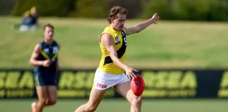 MELBOURNE, AUSTRALIA - APRIL 13: Tom McCarthy of the Tigers kicks during the Marsh AFL National Academy Boys match between Australia U18 and Richmond VFL at RSEA Park on April 13, 2025 in Melbourne, Australia. (Photo by Josh Chadwick/AFL Photos/via Getty Images)