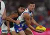 “We’ve been really targeted”: VFL outfit sign delisted North Melbourne midfielder MELBOURNE, AUSTRALIA - APRIL 18: Darcy Tucker of the Kangaroos handballs under pressure during the round six AFL match between North Melbourne Kangaroos and Carlton Blues at Marvel Stadium, on April 18, 2025, in Melbourne, Australia. (Photo by Daniel Pockett/Getty Images)