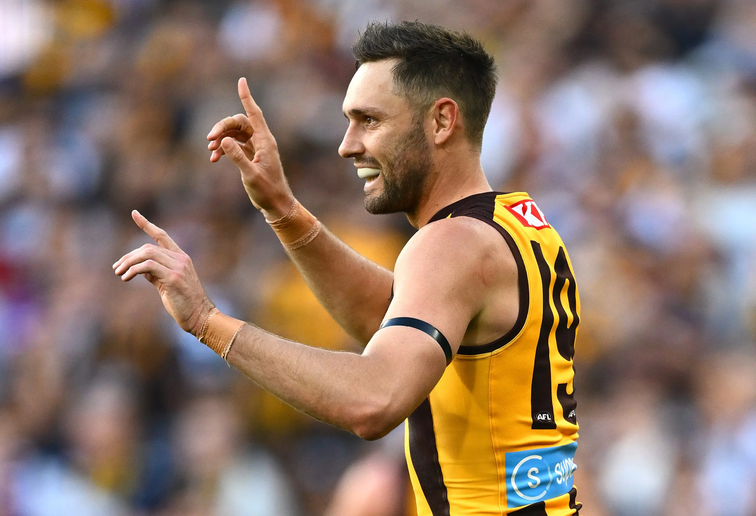 MELBOURNE, AUSTRALIA - APRIL 21: Jack Gunston of the Hawks celebrates kicking a goal during the round six AFL match between Geelong Cats and Hawthorn Hawks at Melbourne Cricket Ground, on April 21, 2025, in Melbourne, Australia. (Photo by Quinn Rooney/Getty Images)