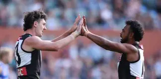 ADELAIDE, AUSTRALIA - APRIL 26: Darcy Byrne-Jones of the Power celebrates a goal with teammate Willie Rioli during the round seven AFL match between Port Adelaide Power and North Melbourne Kangaroos at Adelaide Oval, on April 26, 2025, in Adelaide, Australia. (Photo by Maya Thompson/Getty Images)