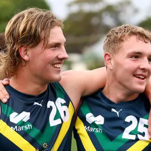 MELBOURNE, AUSTRALIA - APRIL 27: Oliver Greeves and Koby Evans of the AFL National Academy celebrate winning the Marsh AFL National Academy Boys match between Australia U18 and Coburg VFL at Whitten Oval on April 27, 2025 in Melbourne, Australia. (Photo by Josh Chadwick/AFL Photos/via Getty Images)