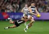 MELBOURNE, AUSTRALIA - MAY 03: Shaun Mannagh of the Cats is tackled by Bobby Hill of the Magpies during the 2025 AFL Round 08 match between the Collingwood Magpies and the Geelong Cats at the Melbourne Cricket Ground on May 3, 2025 in Melbourne, Australia. (Photo by Michael Willson/AFL Photos via Getty Images)