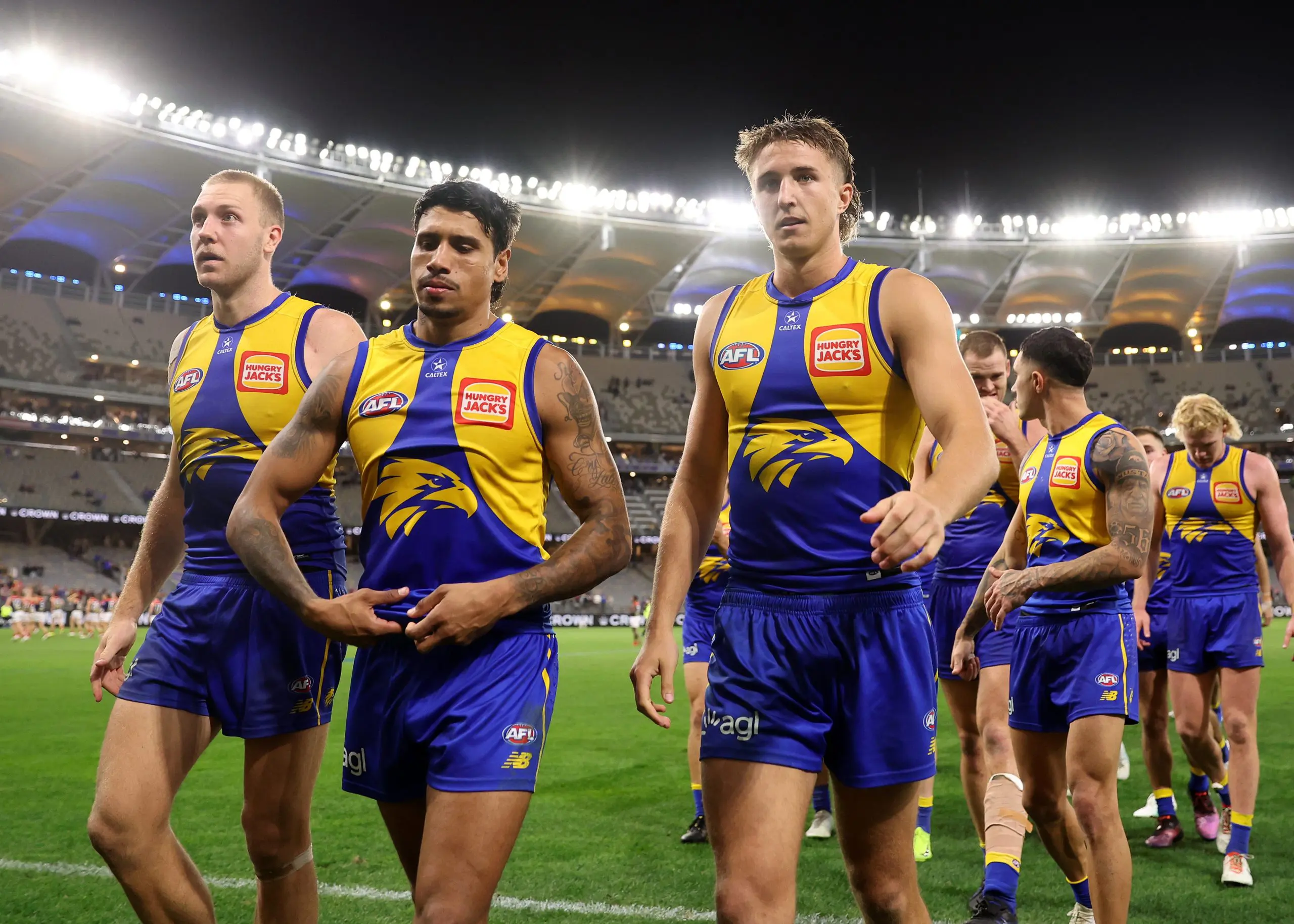 PERTH, AUSTRALIA - MAY 03: Oscar Allen, Tim Kelly & Bo Allan of the Eagles leave the field during the 2025 AFL Round 08 match between the West Coast Eagles and the Melbourne Demons at Optus Stadium on May 3, 2025 in Perth, Australia. (Photo by Janelle St Pierre/AFL Photos via Getty Images)