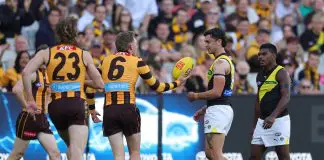 MELBOURNE, AUSTRALIA - MAY 04: James Sicily of the Hawks and Tim Taranto, Maurice Rioli of the Tigers during the 2025 AFL Round 08 match between the Hawthorn Hawks and the Richmond Tigers at the Melbourne Cricket Ground on May 4, 2025 in Melbourne, Australia. (Photo by James Wiltshire/AFL Photos via Getty Images)