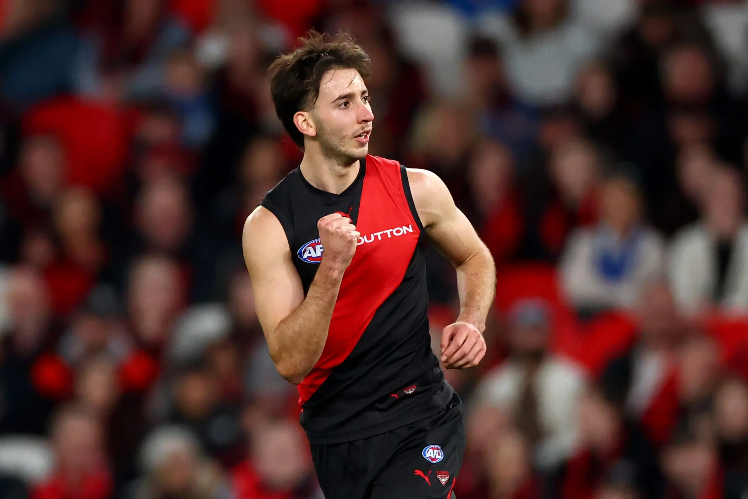 MELBOURNE, AUSTRALIA - MAY 01: Nic Martin of the Bombers celebrates kicking a goalduring the round eight AFL match between Essendon Bombers and North Melbourne Kangaroos at Marvel Stadium, on May 01, 2025, in Melbourne, Australia. (Photo by Josh Chadwick/Getty Images)