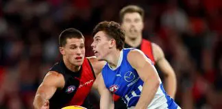 Demons great joins chorus of praise for young Roo MELBOURNE, AUSTRALIA - MAY 01: Finn O'Sullivan of the Kangaroos handballs whilst being tackled by esapduring the round eight AFL match between Essendon Bombers and North Melbourne Kangaroos at Marvel Stadium, on May 01, 2025, in Melbourne, Australia. (Photo by Josh Chadwick/Getty Images)