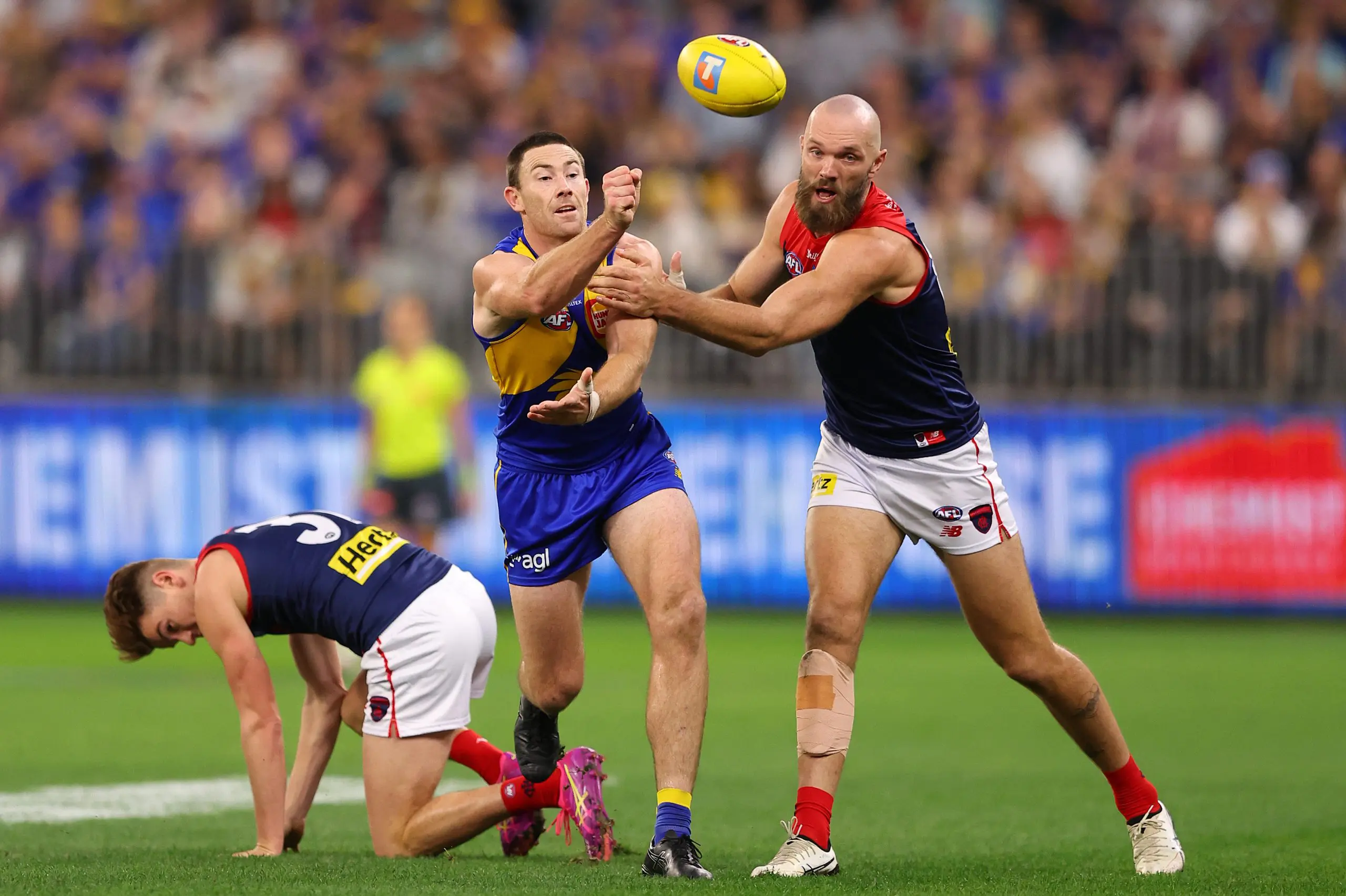 PERTH, AUSTRALIA - MAY 03: Jeremy McGovern of the Eagles handballs during the round eight AFL match between West Coast Eagles and Melbourne Demons at Optus Stadium, on May 03, 2025, in Perth, Australia. (Photo by Paul Kane/Getty Images)