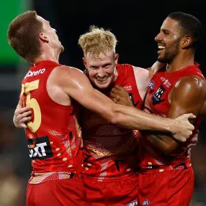 DARWIN, AUSTRALIA - MAY 10: (L-R) Noah Anderson, John Noble and Touk Miller of the Suns celebrate during the 2025 AFL Round 09 match between the Gold Coast Suns and the Western Bulldogs at TIO Stadium on May 10, 2025 in Darwin, Australia. (Photo by Michael Willson/AFL Photos via Getty Images)