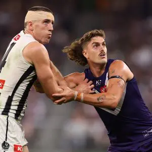 PERTH, AUSTRALIA - MAY 08: Darcy Cameron of the Magpies and Luke Jackson of the Dockers contest the ruck during the round nine AFL match between Fremantle Dockers and Collingwood Magpies at Optus Stadium, on May 08, 2025, in Perth, Australia. (Photo by Paul Kane/Getty Images)
