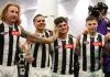PERTH, AUSTRALIA - MAY 08: Bobby Hill of the Magpies covers the ears of Lachie Schultz as the club song is sung after winning the round nine AFL match between Fremantle Dockers and Collingwood Magpies at Optus Stadium, on May 08, 2025, in Perth, Australia. (Photo by Paul Kane/Getty Images)