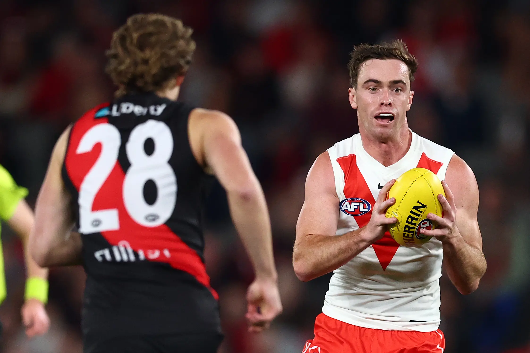 MELBOURNE, AUSTRALIA - MAY 10: Ben Paton of the Swans marks the ball during the round nine AFL match between Essendon Bombers and Sydney Swans at Marvel Stadium, on May 10, 2025, in Melbourne, Australia. (Photo by Morgan Hancock/Getty Images)