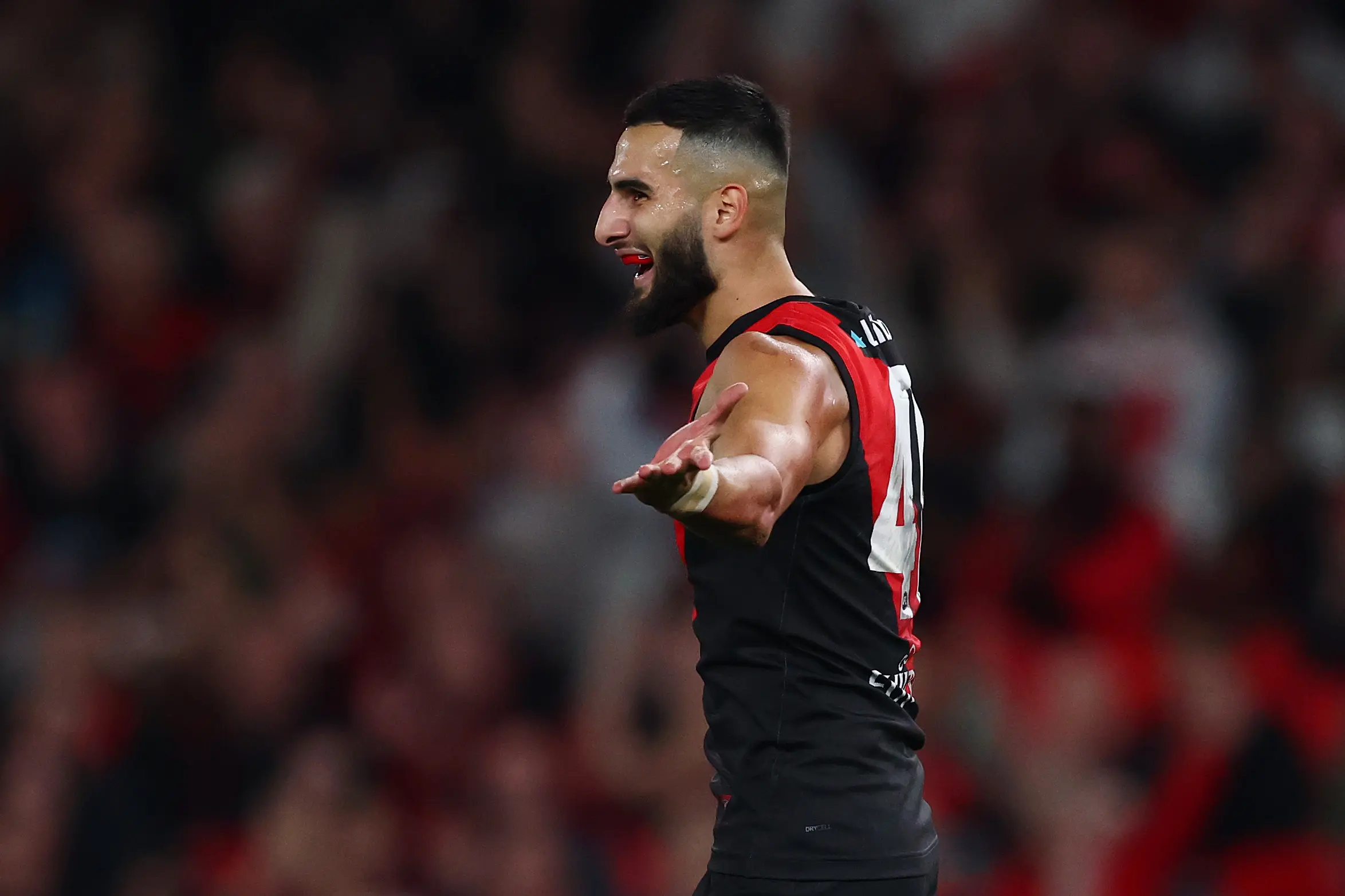 MELBOURNE, AUSTRALIA - MAY 10: Saad El-Hawli of the Bombers celebrates a goal during the round nine AFL match between Essendon Bombers and Sydney Swans at Marvel Stadium, on May 10, 2025, in Melbourne, Australia. (Photo by Morgan Hancock/Getty Images)