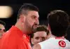MELBOURNE, AUSTRALIA - MAY 10: Dean Cox, Head Coach of the Swans speaks to players at quarter time during the round nine AFL match between Essendon Bombers and Sydney Swans at Marvel Stadium, on May 10, 2025, in Melbourne, Australia. (Photo by Morgan Hancock/Getty Images)