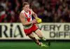 MELBOURNE, AUSTRALIA - MAY 10: Isaac Heeney of the Swans falls over whilst running with the ball during the round nine AFL match between Essendon Bombers and Sydney Swans at Marvel Stadium, on May 10, 2025, in Melbourne, Australia. (Photo by Morgan Hancock/Getty Images)