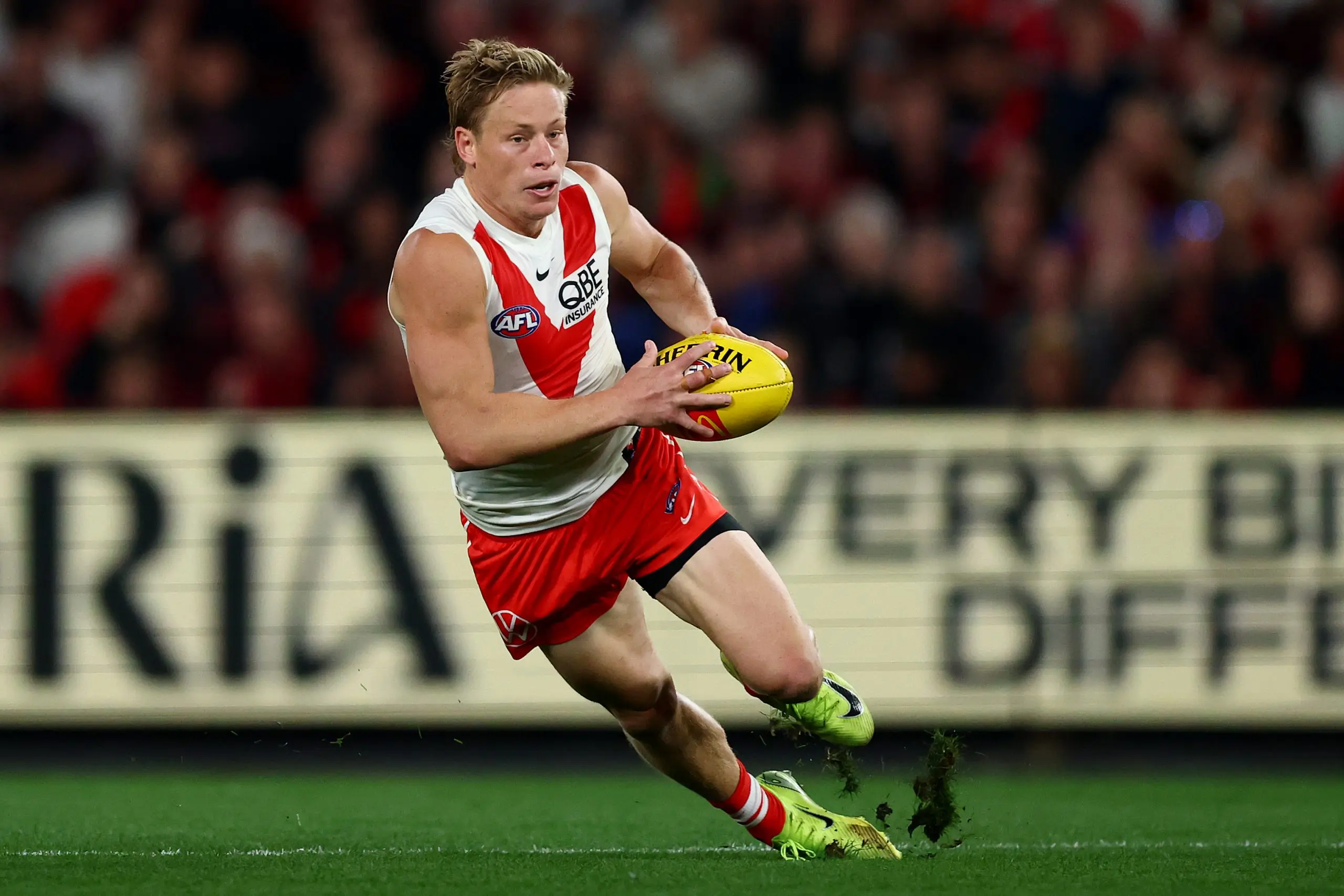 MELBOURNE, AUSTRALIA - MAY 10: Isaac Heeney of the Swans falls over whilst running with the ball during the round nine AFL match between Essendon Bombers and Sydney Swans at Marvel Stadium, on May 10, 2025, in Melbourne, Australia. (Photo by Morgan Hancock/Getty Images)