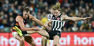ADELAIDE, AUSTRALIA - MAY 10: Jordan Dawson of the Crows competes with Miles Bergman of the Power  during the round nine AFL match between Port Adelaide Power and Adelaide Crows at Adelaide Oval, on May 10, 2025, in Adelaide, Australia. (Photo by Mark Brake/Getty Images)